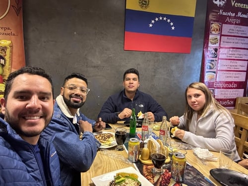 Raul and three friends at an arepa restaurant